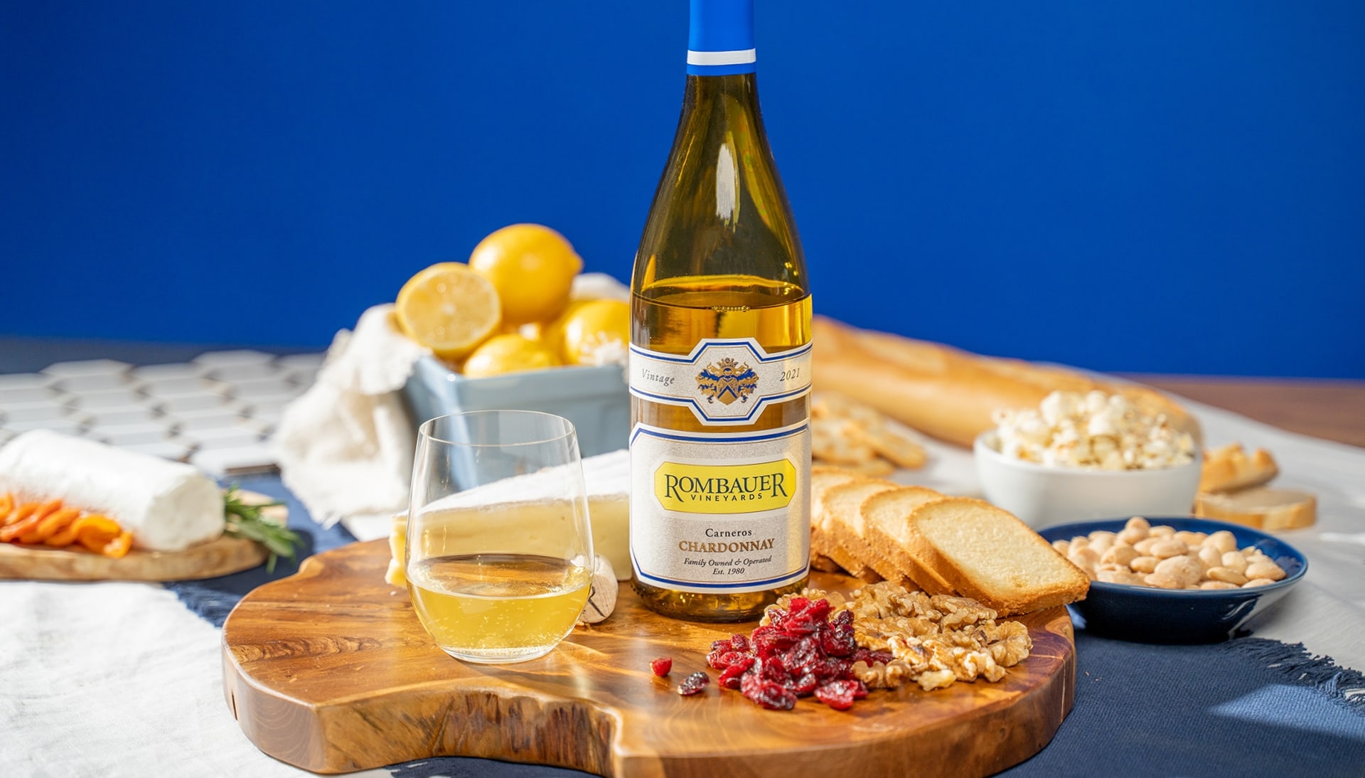 A bottle of white Rombauer wine on a charcuterie board